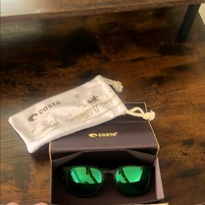Costa Sunglasses with Black Frames and Green Lenses
